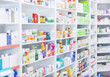 © Karanov images - Medicines arranged in shelves at pharmacy out of the focusPharmacy background photo