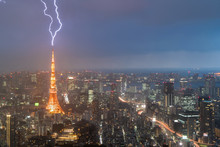 Lightning Storm Over Tokyo City, Japan In Night With Thunderbolt Over Tokyo Tower. Thunderstorm In Tokyo, Japan.