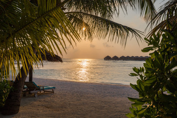 Wall Mural - Sunset from the beach overlooking Overwater Bungalows