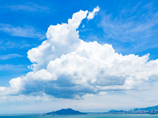 Wall Mural - blue sky with white clouds over penang brigde