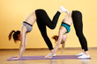 © snedorez - Girls doing yoga on rug