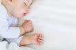 © LIGHTFIELD STUDIOS - Close-up portrait of adorable baby boy sleeping in bed, 1 year old baby concept