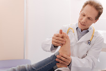 Friendly Careful Rheumatologist Making Sure Patient Being Healthy