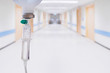 © Kwangmoozaa - Medical drip with hospital blurred background