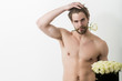 © Volodymyr - muscular sexy man with rose flower bouquet