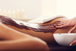 © Kalim - Beautiful woman getting chocolate massage in spa