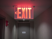 Glowing Red Exit Sign.