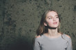© Volodymyr - girl on wall background, young woman with beautiful blond hair