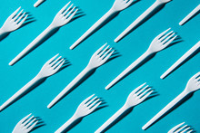 Top View Of Set Of Plastic Forks Isolated On Blue