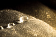 © HappyRichStudio - Drops of water close-up macro on velvet material with sun glare