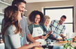 © Flamingo Images - Group of friends cooking.