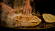 Roti or Indian Bread being baked on a pan