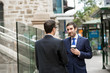 © Sergey Nivens - Two businessmen talking outdoors