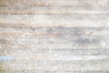 blurred wooden background with snow winter