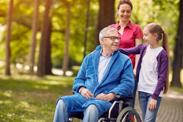 Wall Mural - Happy wheelchair man with daughter and granddaughter.