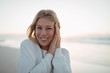 © WavebreakMediaMicro - Portrait of smiling young woman at beach