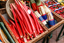 Red Appetizing Rhubarb Stalks For Sale At A Farmers Open Street Market Counter