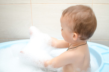 Wall Mural - Happy baby boy taking a bath