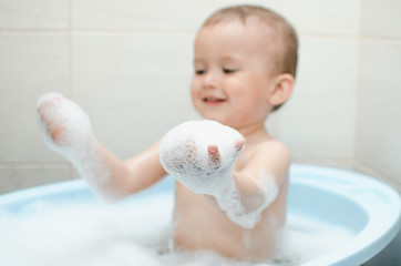 Wall Mural - Happy baby boy taking a bath