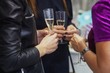 © kohanova1991 - Portrait of happy young friends touching the glasses with each other
