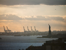 Statue Of Liberty And Cranes.