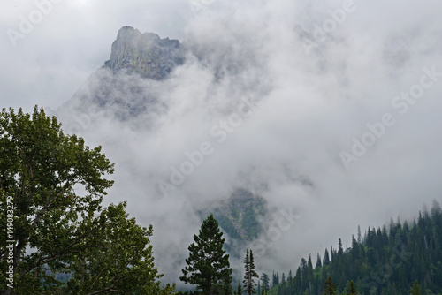 Fotografia, Obraz Fog covers the mountains of Glacier National Park.