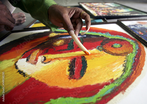 Nail Artist Paints On A Canvas During A Painting Exhibition In The
