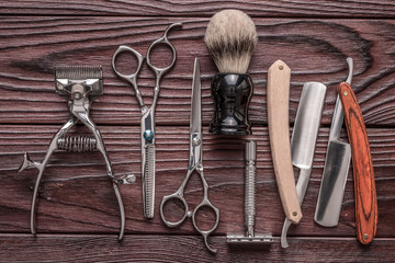 Vintage barber shop tools on wooden background