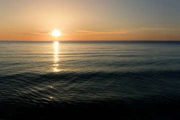  sunrise on the water / Early summer morning bright sky Beach