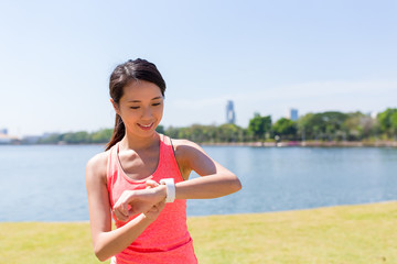 Wall Mural - Woman using smart watch