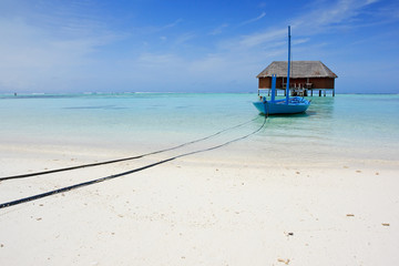 blue boat on tropical beach