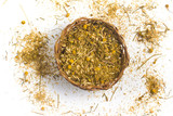 Fototapeta Mapy - Dry chamomile into a basket