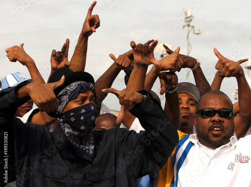 Members Of The Eastside Crips Flash Gang Signs While Arriving To