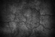 Cracked black concrete wall, gloomy cement texture background