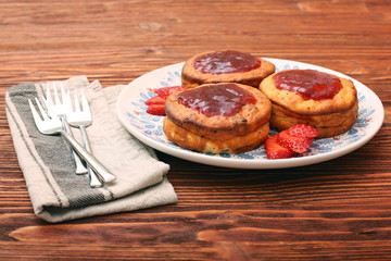 Wall Mural - Cottage cheese patties with strawberry jam.