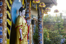 Standing Amitabha Buddha Statue On The Entrance To Quang Minh Mahayana Buddhism Temple In Da Nang, Vietnam 