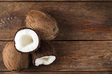 Ripe Fresh Coconuts On Wooden Rustic Table Background, Flat Lay With Copy Space. Exotic Tropical Fruits.