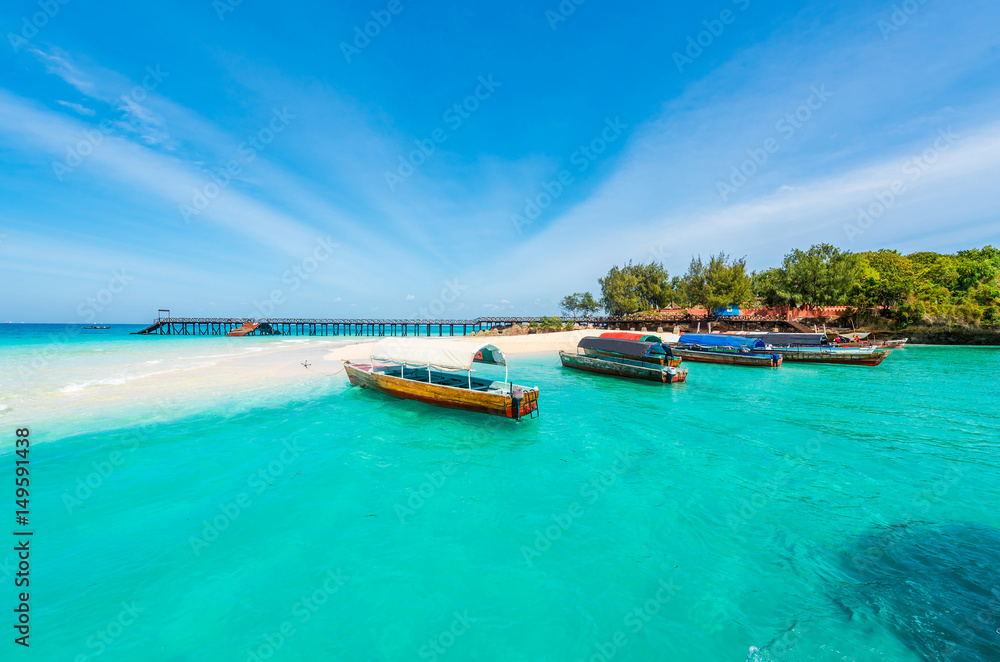 colorful exotic seascape with boats near Zanzibar shore in Africa - obrazy, fototapety, plakaty 