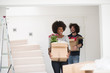 © .shock - multiethnic couple moving into a new home