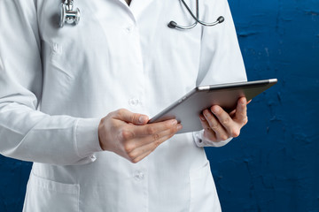 Poster - computer tablet in the hands of doctor