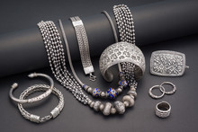 Collection Of Antique Traditional Silver Jewelry On Black Paper