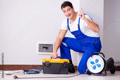 Cuadros en Lienzo Man doing electrical repairs at home
