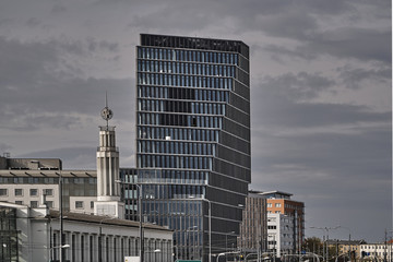 Wall Mural - Cityscape with fair tower and modern office building in Poznan.