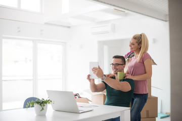 Young couple moving in a new home