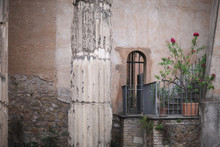 A Small Balcony With Flowers In Pots In A Medieval Building. Rome, Italy