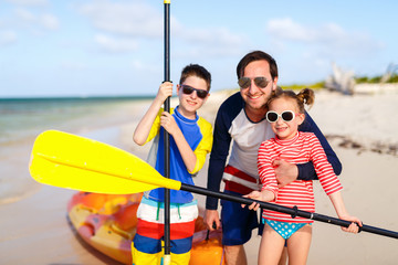 Wall Mural - Family kayaking at tropical ocean