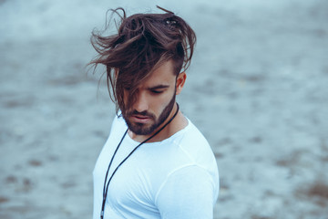 Portrait of a man with beard and modern hairstyle