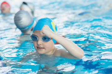 Wall Mural - young and successful swimmers pose