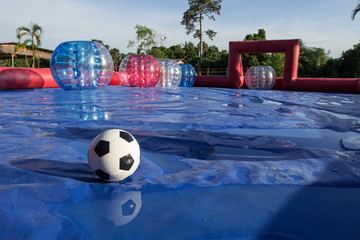 Zorb ball football game Field with ball.