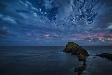 Wall Mural - beautiful seascape, ocean and rocks at night, blue tone nocturne image